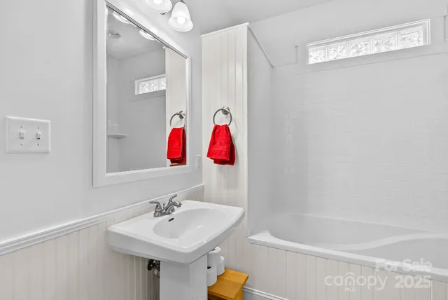 a bathroom with a sink and a bathtub