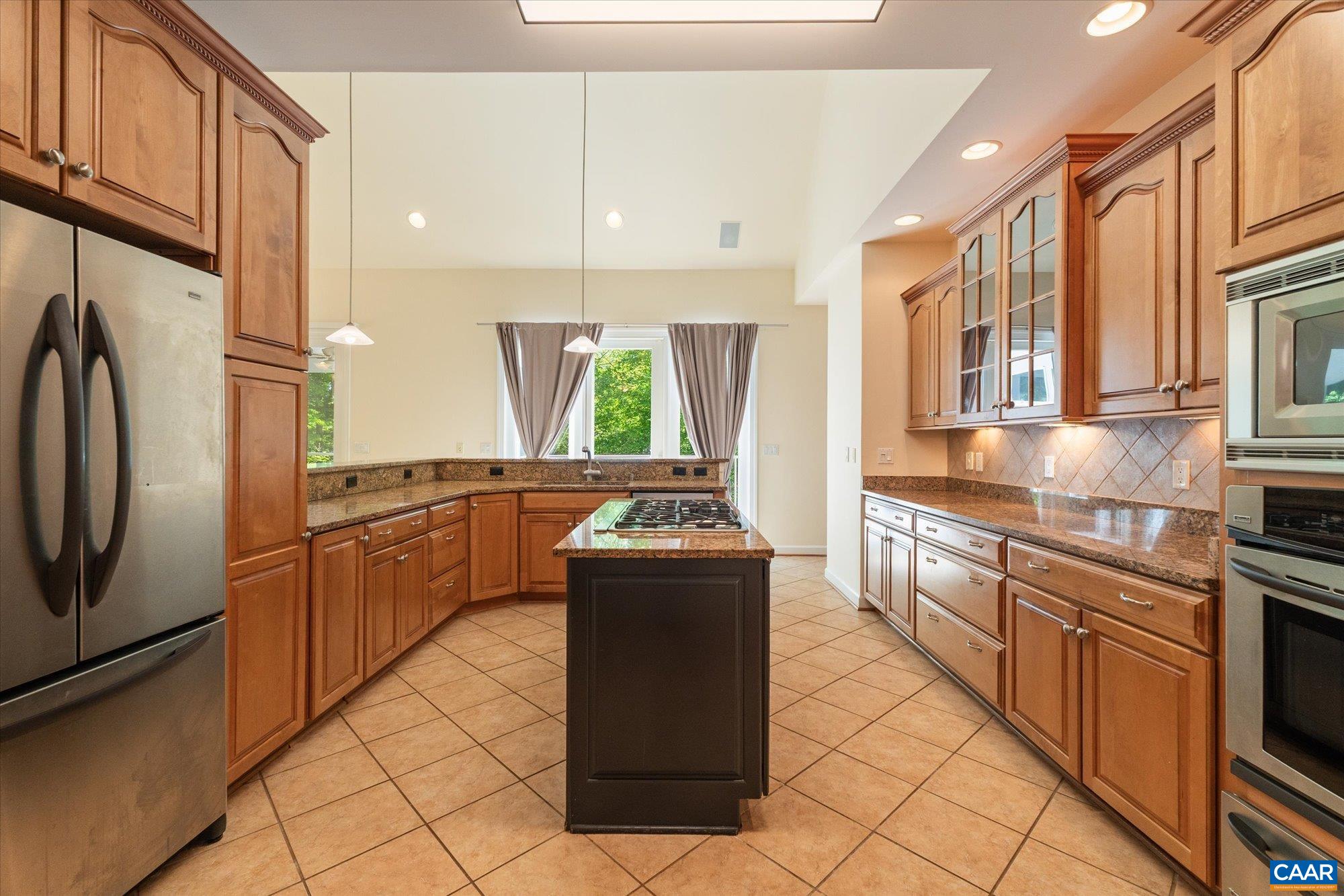 1698 Broken Island Road Palmyra, VA 22963 - Photo 17 of 74 a kitchen with stainless steel appliances granite countertop a stove a sink and a refrigerator