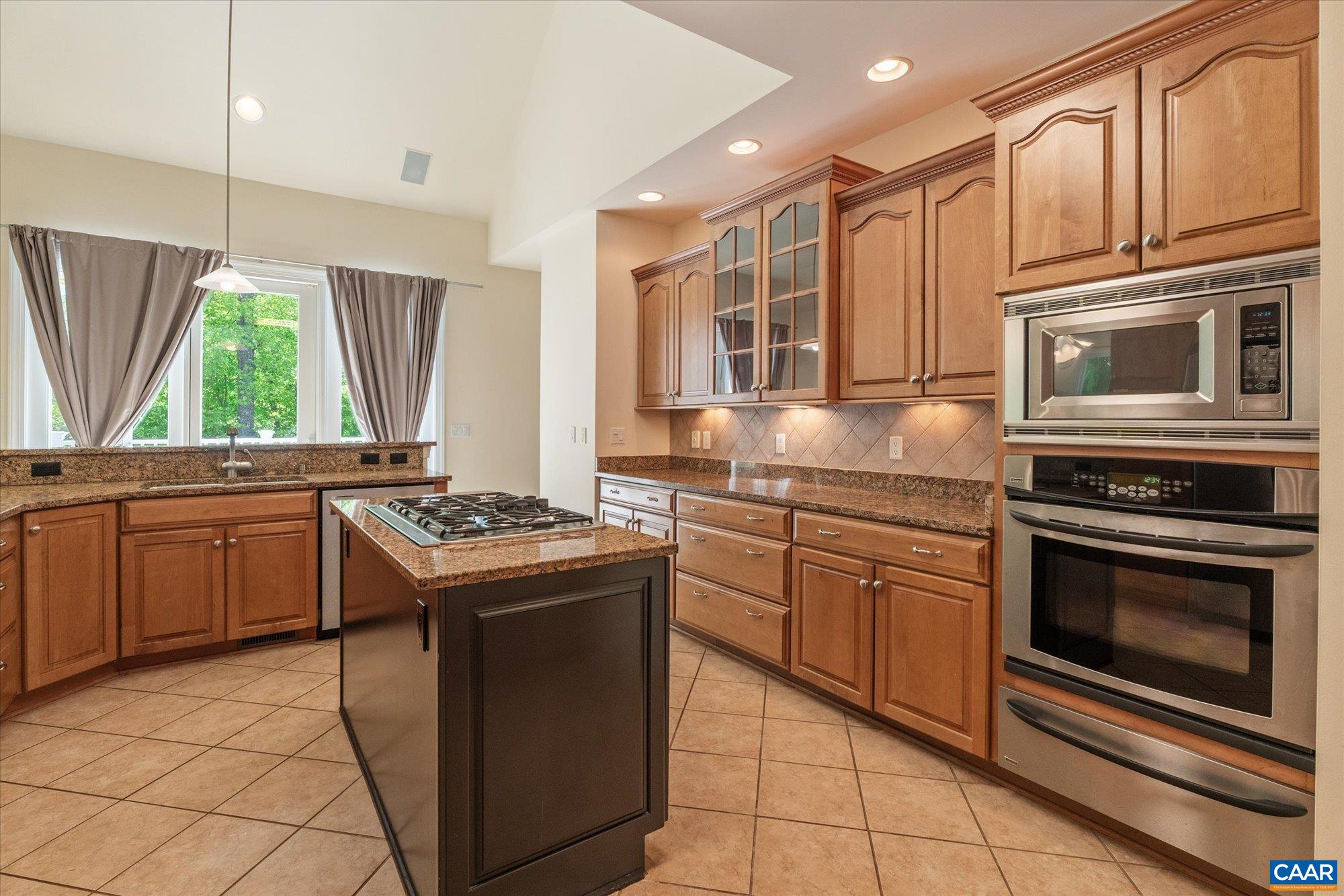 1698 Broken Island Road Palmyra, VA 22963 - Photo 18 of 74 a kitchen with granite countertop a stove sink and microwave