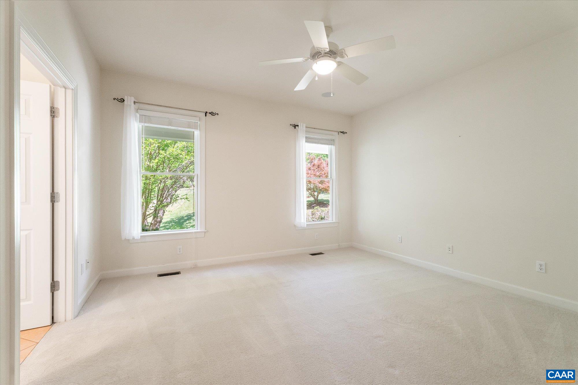 1698 Broken Island Road Palmyra, VA 22963 - Photo 38 of 74 an empty room with windows and chandelier fan