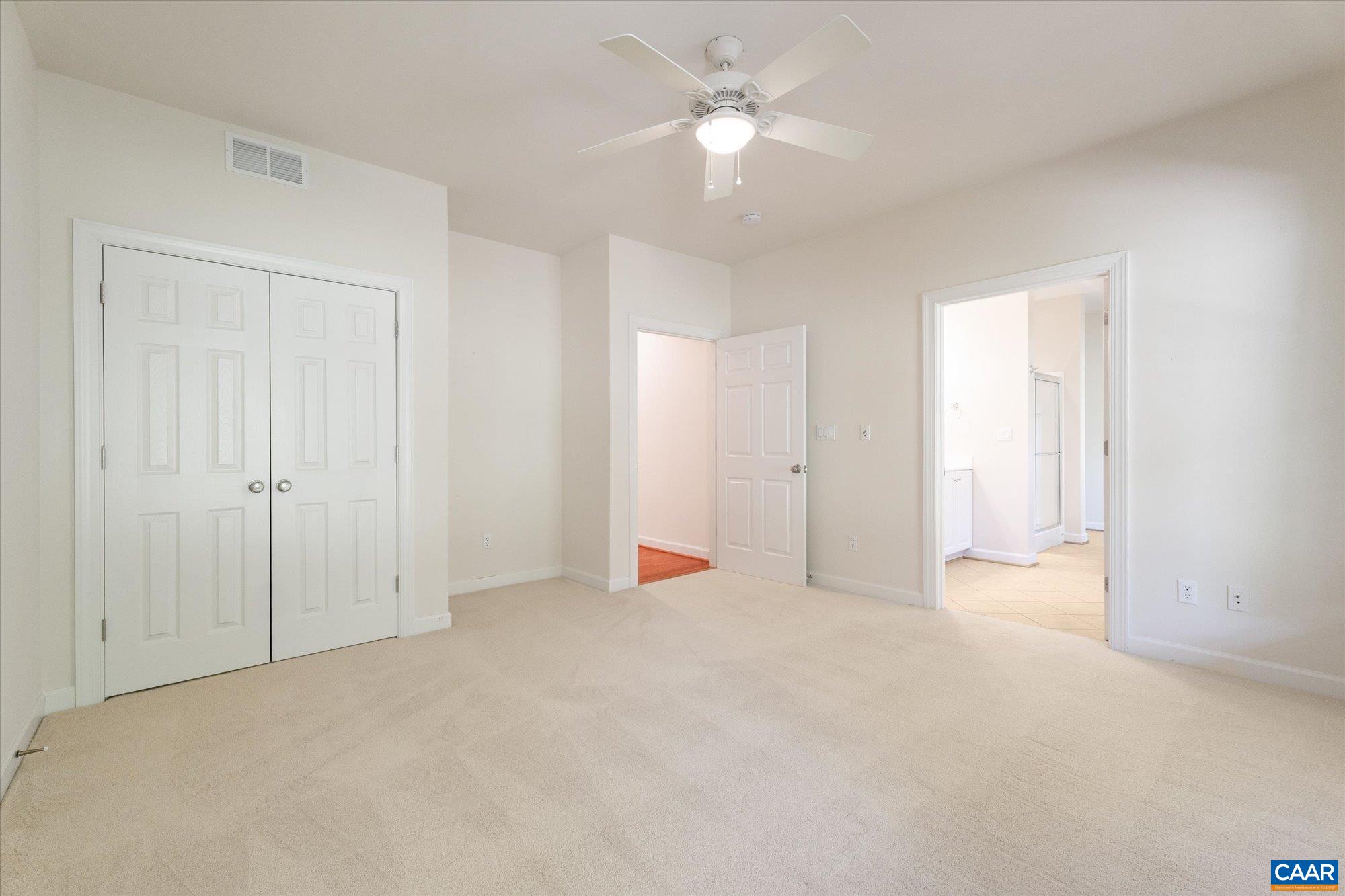 1698 Broken Island Road Palmyra, VA 22963 - Photo 39 of 74 an empty room with closet and a ceiling fan