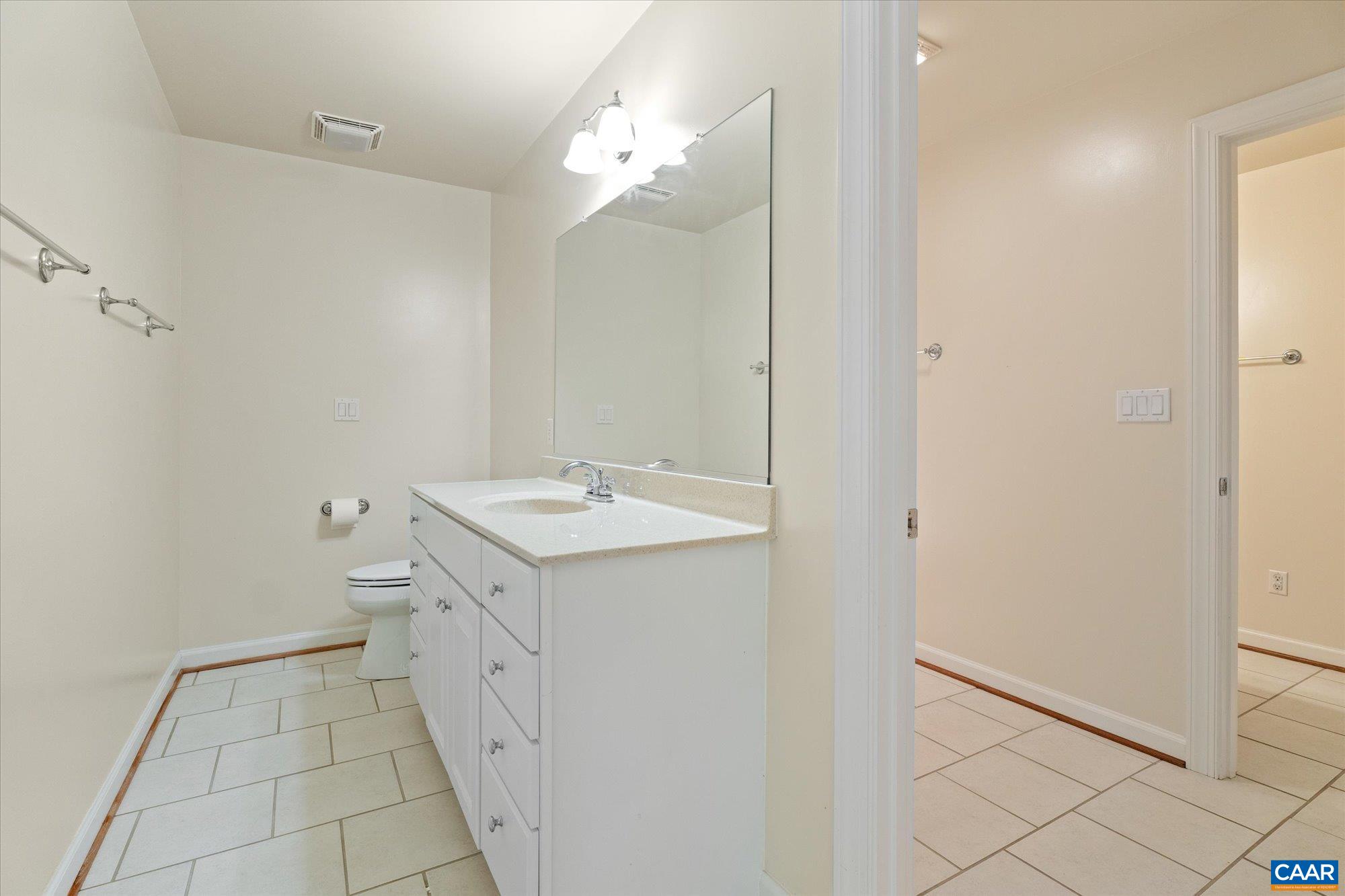 1698 Broken Island Road Palmyra, VA 22963 - Photo 51 of 74 a bathroom with a double vanity sink and mirror