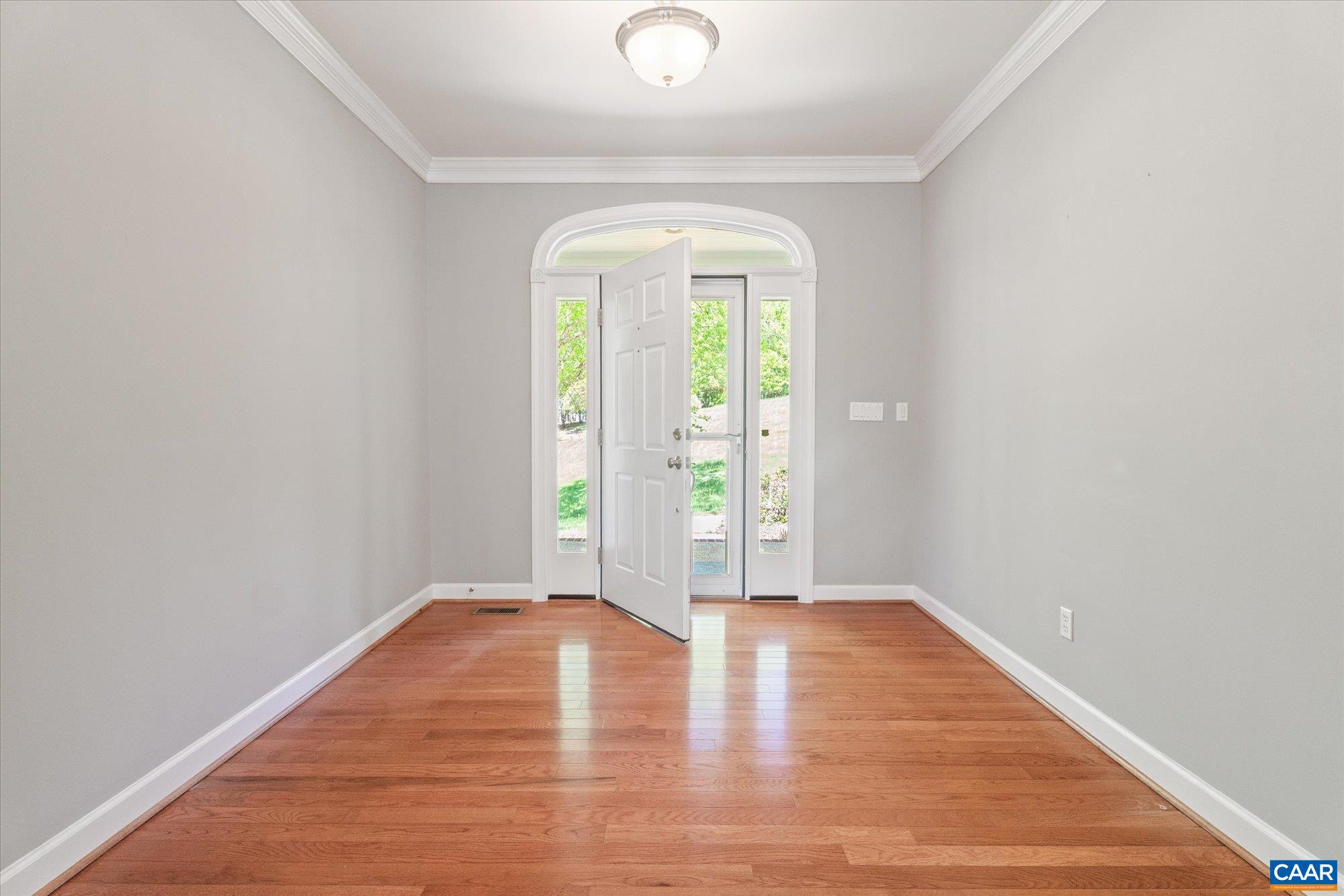 1698 Broken Island Road Palmyra, VA 22963 - Photo 8 of 74 a view of an empty room with wooden floor and a window