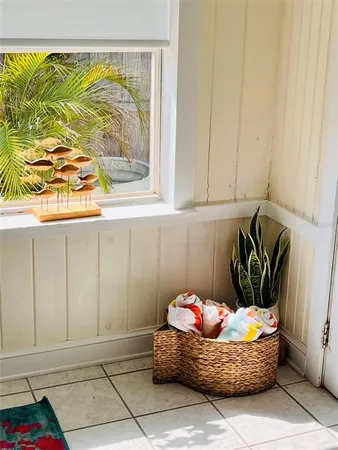a room with a rug and a wooden floor