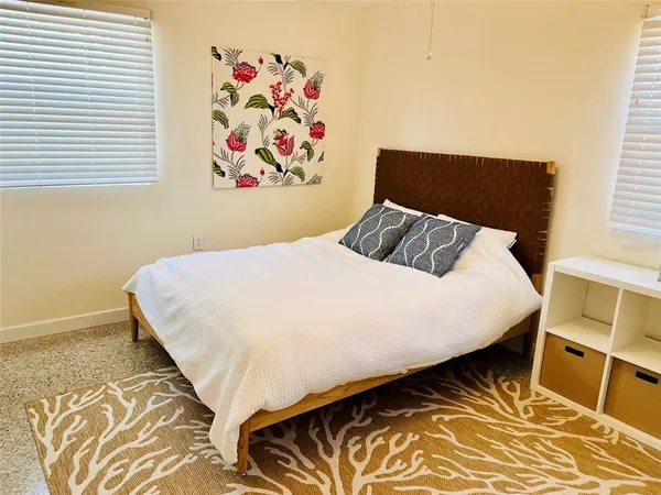 a bedroom with a bed and a couch