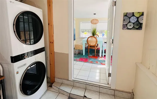 a view of a bedroom with washer and dryer