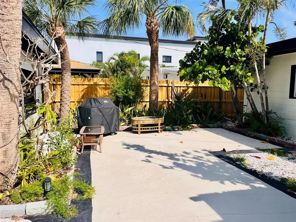 a view of backyard with a patio and swimming pool