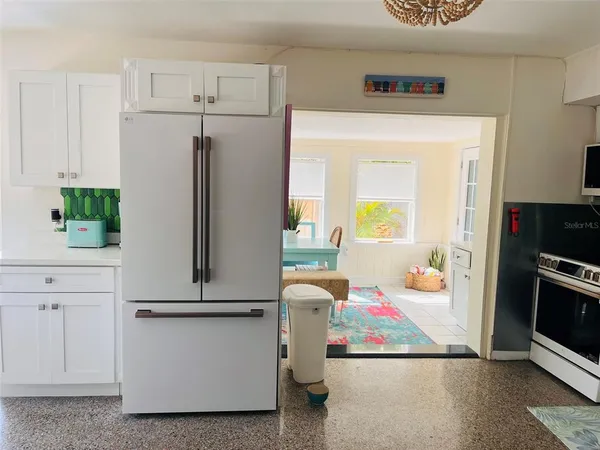 a room with refrigerator and washer