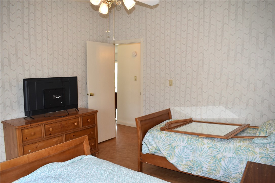25051 Lake Shore Drive Mathis, TX 78368 - Photo 30 of 40 a bedroom with a bed and a dresser