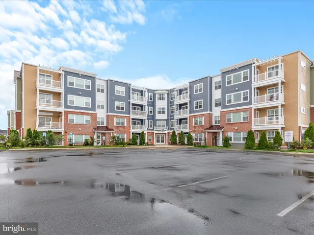 a view of a lake with houses in the back