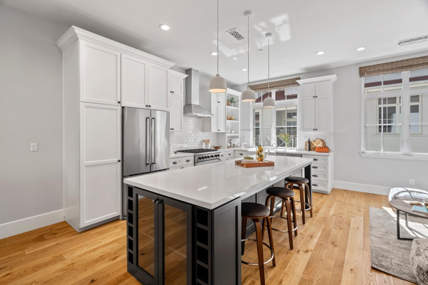 425 Robin Ridge Way Campbell, CA 95008 - Photo 12 of 46 a kitchen with stainless steel appliances granite countertop a table chairs stove and refrigerator