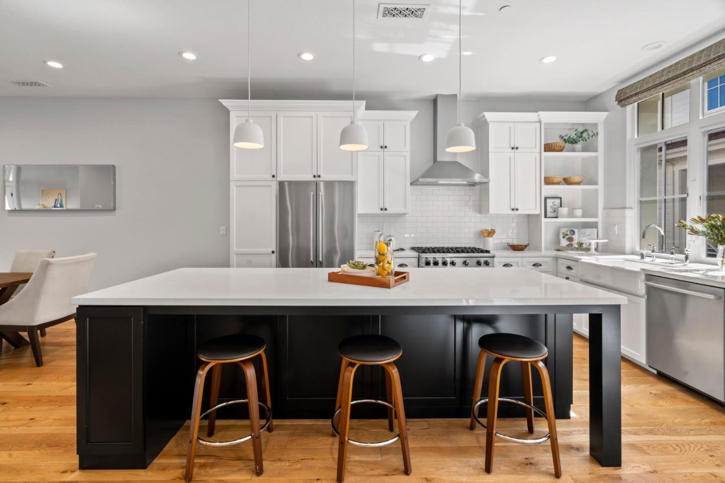 425 Robin Ridge Way Campbell, CA 95008 - Photo 13 of 46 a kitchen with a sink a table and chairs in it