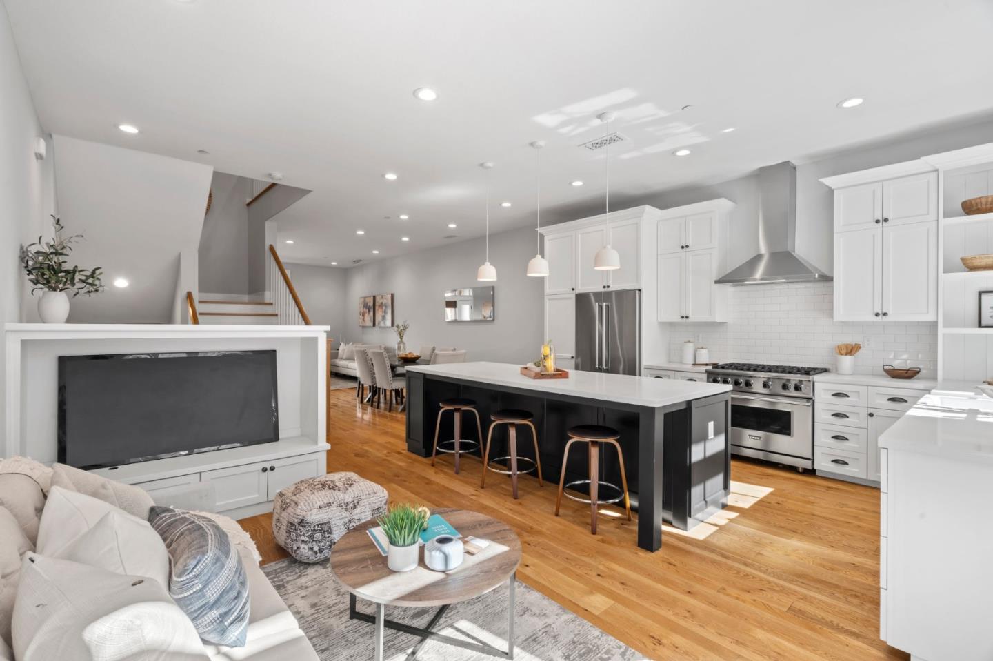425 Robin Ridge Way Campbell, CA 95008 - Photo 16 of 46 a living room with stainless steel appliances kitchen island granite countertop a stove a sink a refrigerator and a fireplace