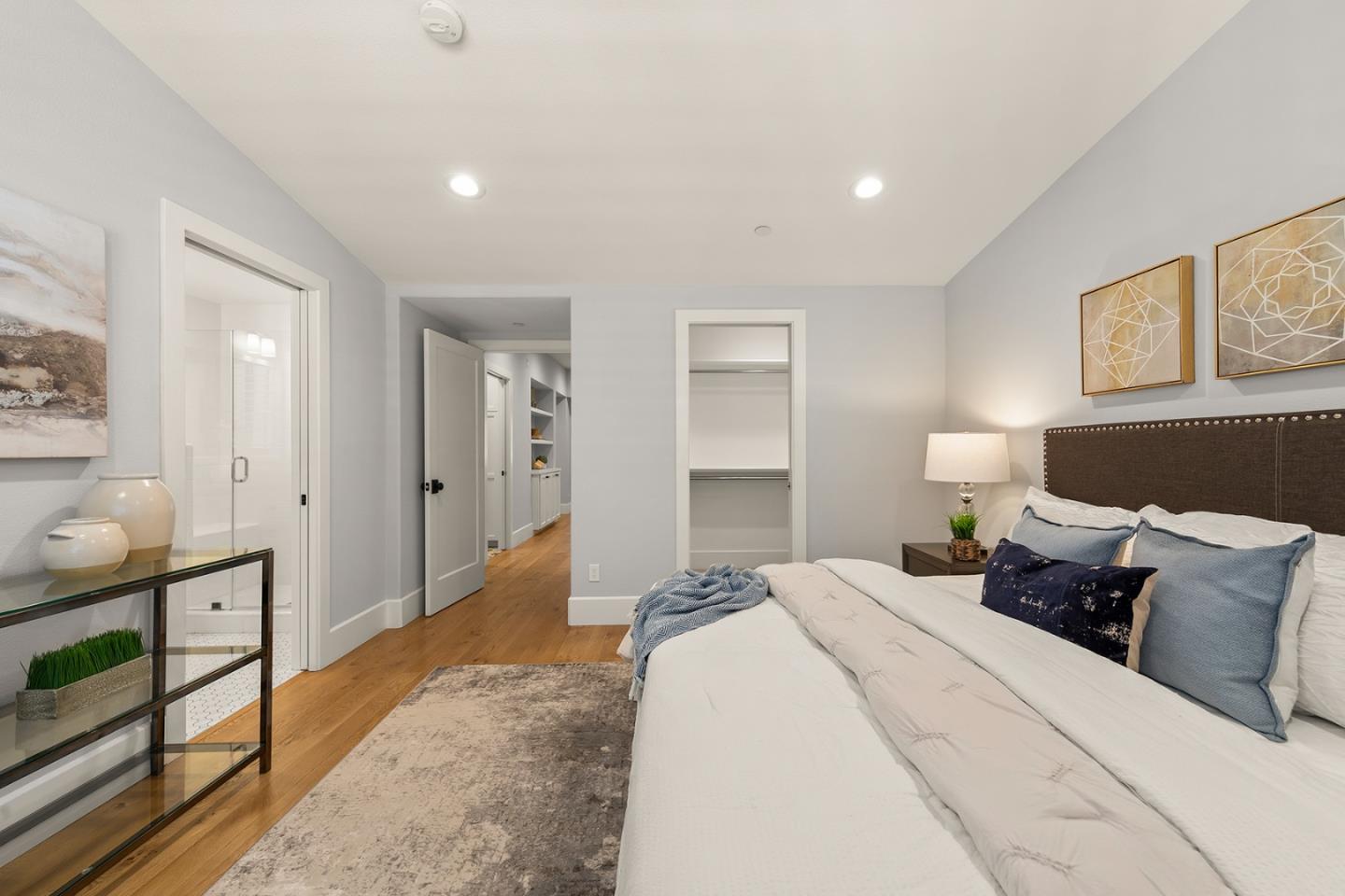 425 Robin Ridge Way Campbell, CA 95008 - Photo 30 of 46 a spacious bedroom with a bed and wooden floor