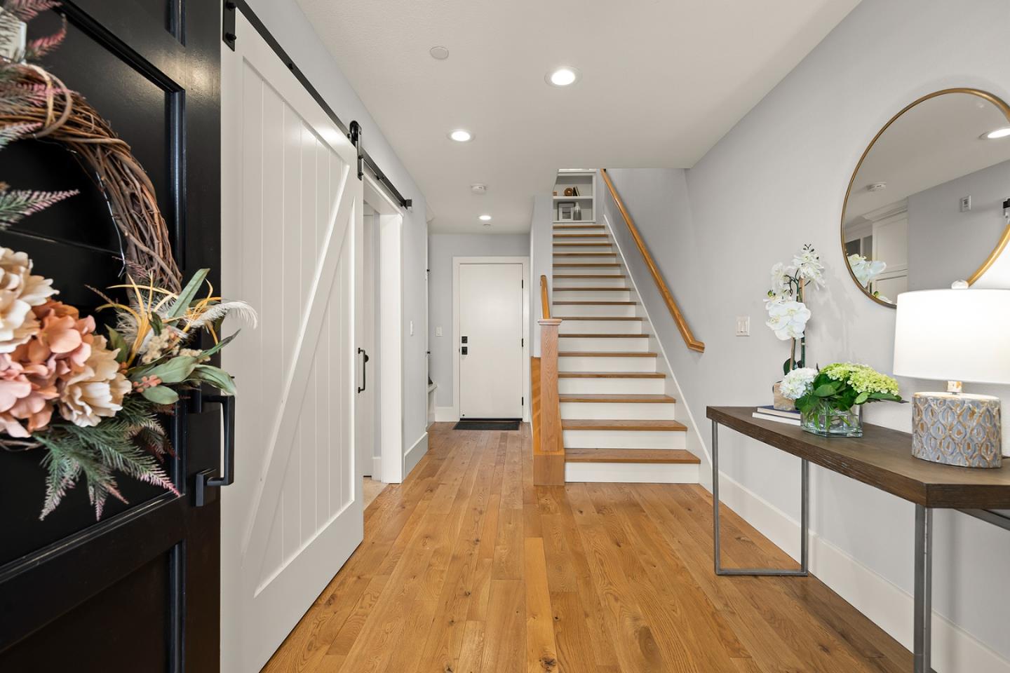 425 Robin Ridge Way Campbell, CA 95008 - Photo 4 of 46 a view of a hallway to a house with wooden floor and stairs
