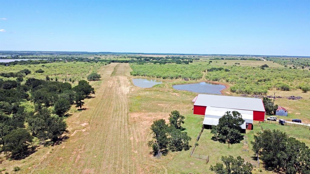 460 Eastside Lake Road Graham, TX 76450 - Photo 19 of 23 a picture of city view with lake and trees in the background