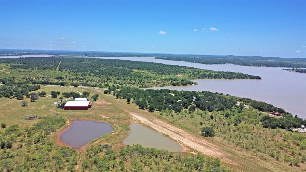 460 Eastside Lake Road Graham, TX 76450 - Photo 20 of 23 a view of a lake with a mountain