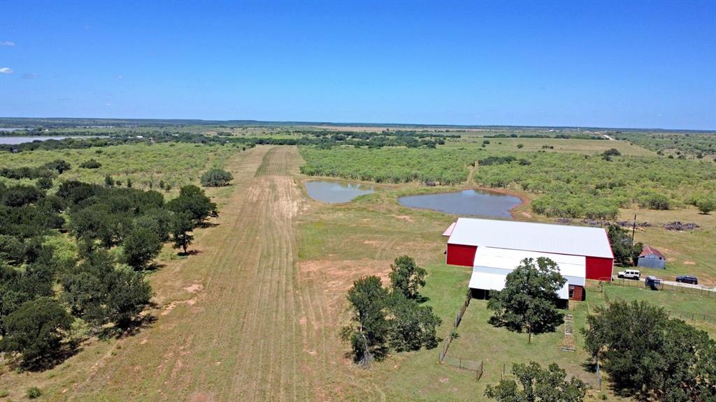 460 Eastside Lake Road Graham, TX 76450 - Photo 23 of 23 an aerial view of residential houses with outdoor space and ocean view