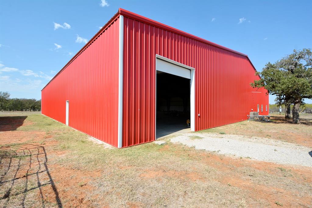 460 Eastside Lake Road Graham, TX 76450 - Photo 8 of 23 a view of a house with a backyard