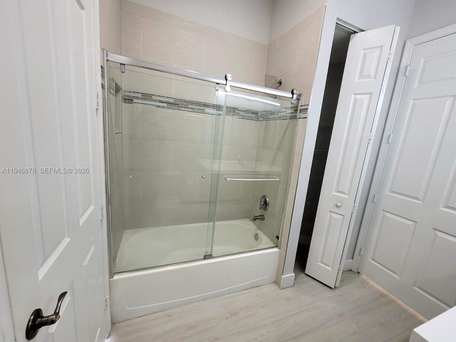 4602 Southwest 160th Avenue, Unit 536 Miramar, FL 33027 - Photo 11 of 30 a bathroom with a shower and a tub