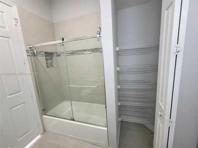 a bathroom with a bath tub