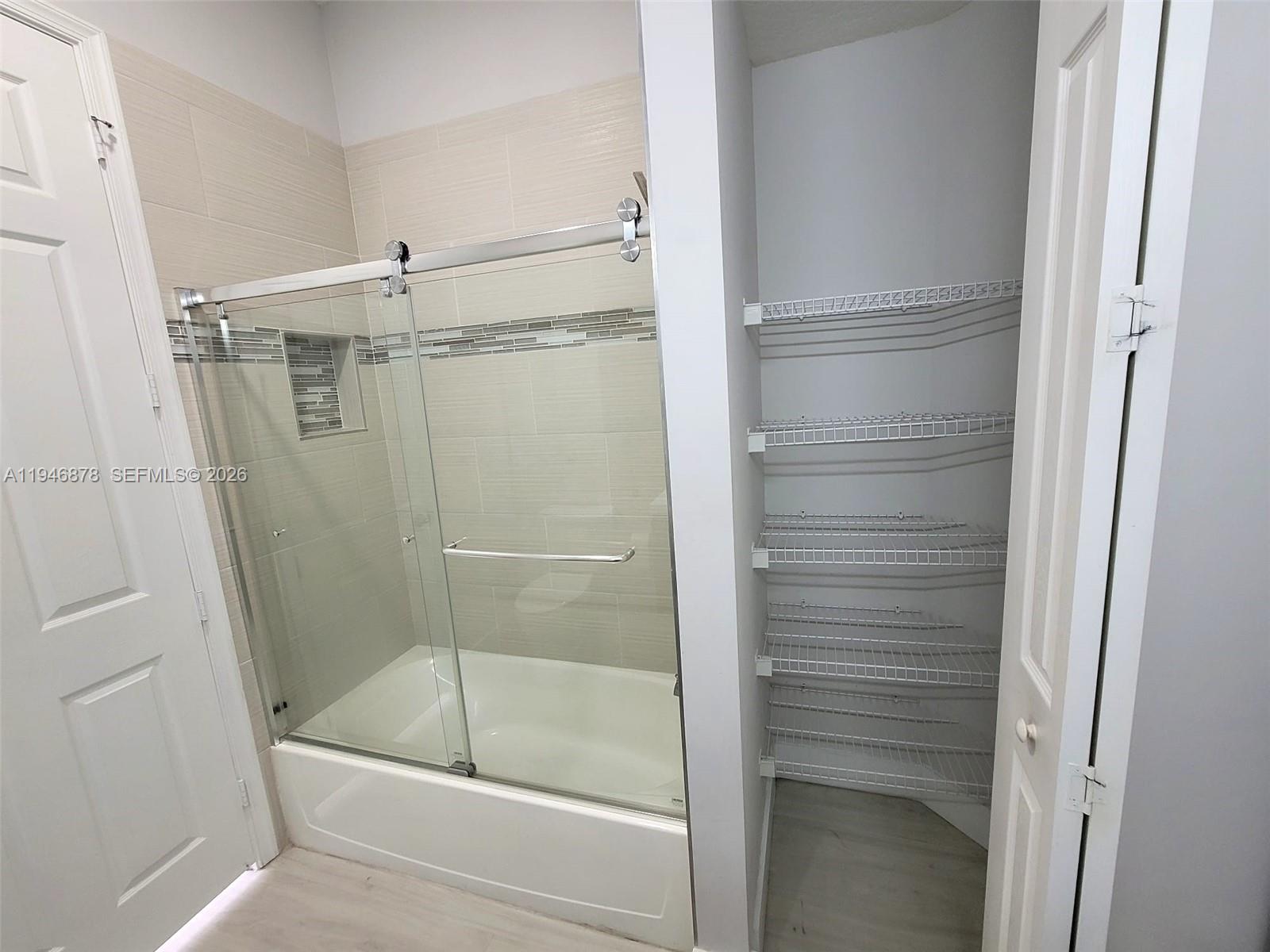 4602 Southwest 160th Avenue, Unit 536 Miramar, FL 33027 - Photo 12 of 30 a bathroom with a bath tub