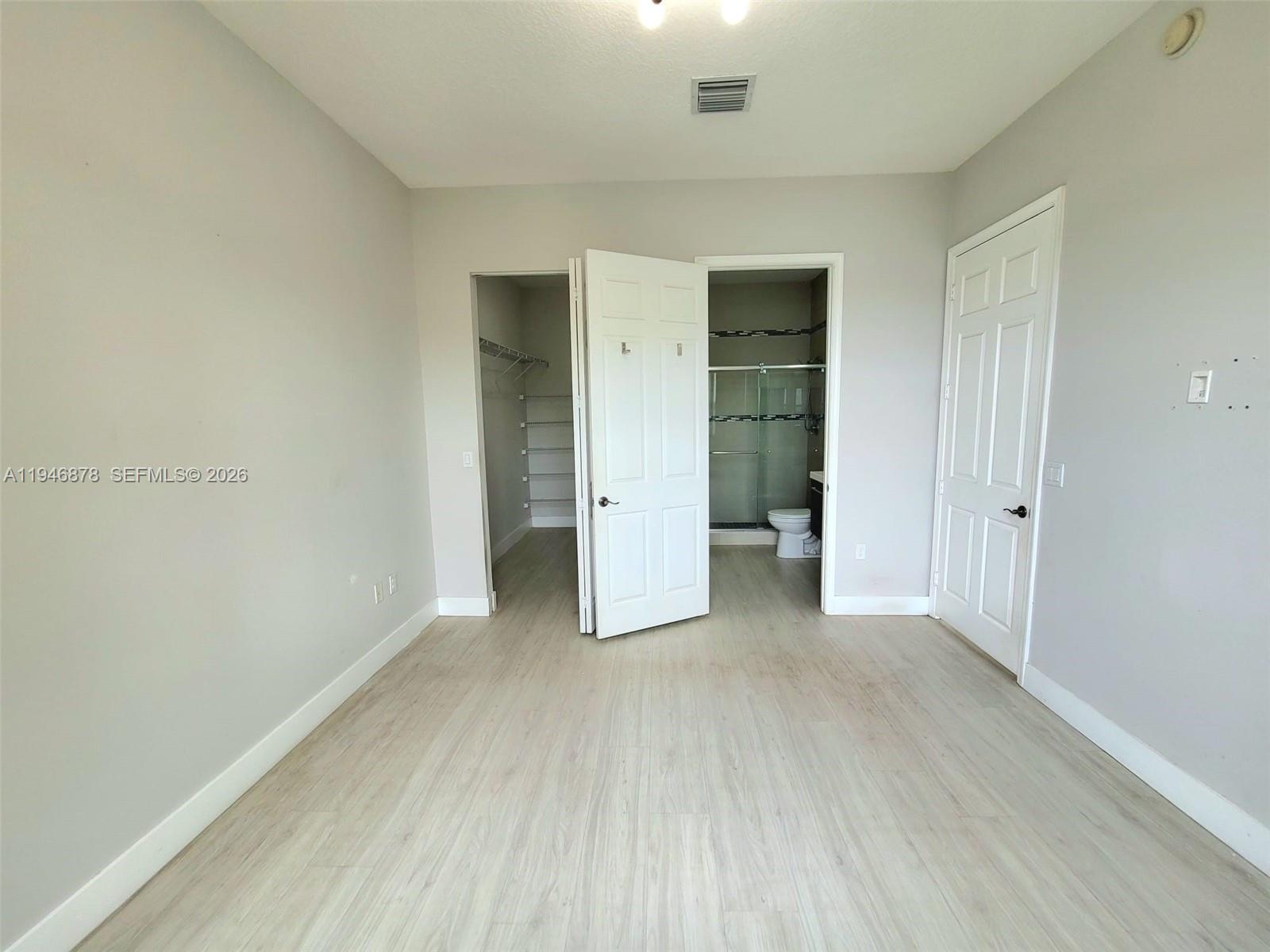 4602 Southwest 160th Avenue, Unit 536 Miramar, FL 33027 - Photo 16 of 30 an empty room with closet and a window