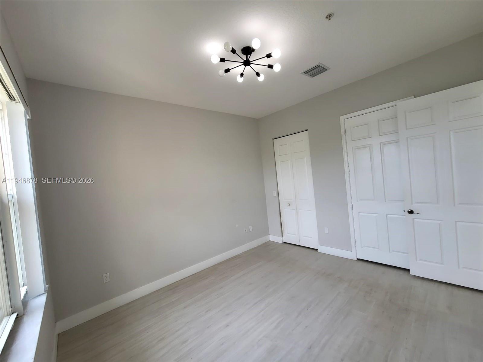 4602 Southwest 160th Avenue, Unit 536 Miramar, FL 33027 - Photo 17 of 30 a view of an empty room with a window