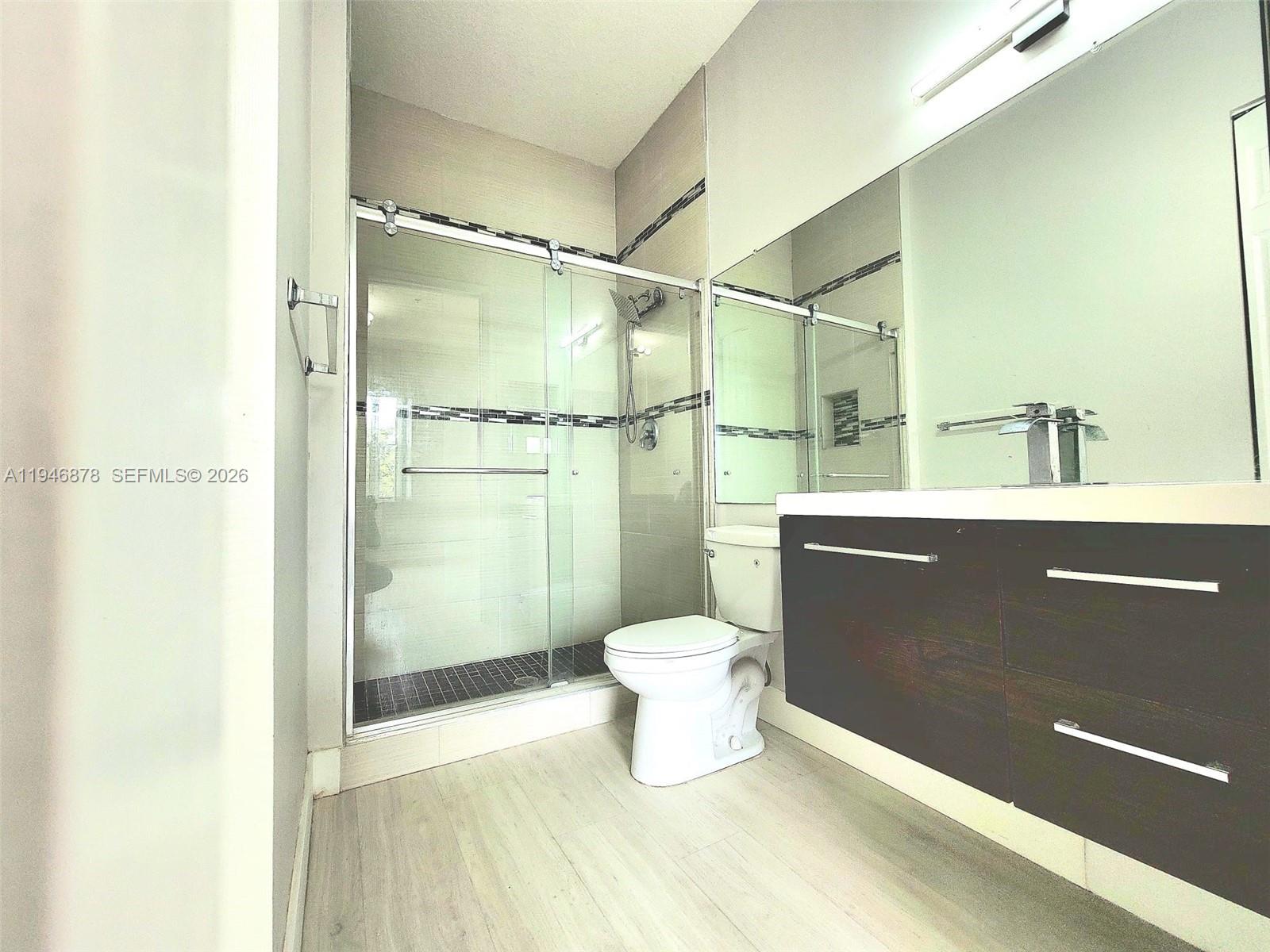 4602 Southwest 160th Avenue, Unit 536 Miramar, FL 33027 - Photo 20 of 30 a bathroom with a sink a toilet and shower