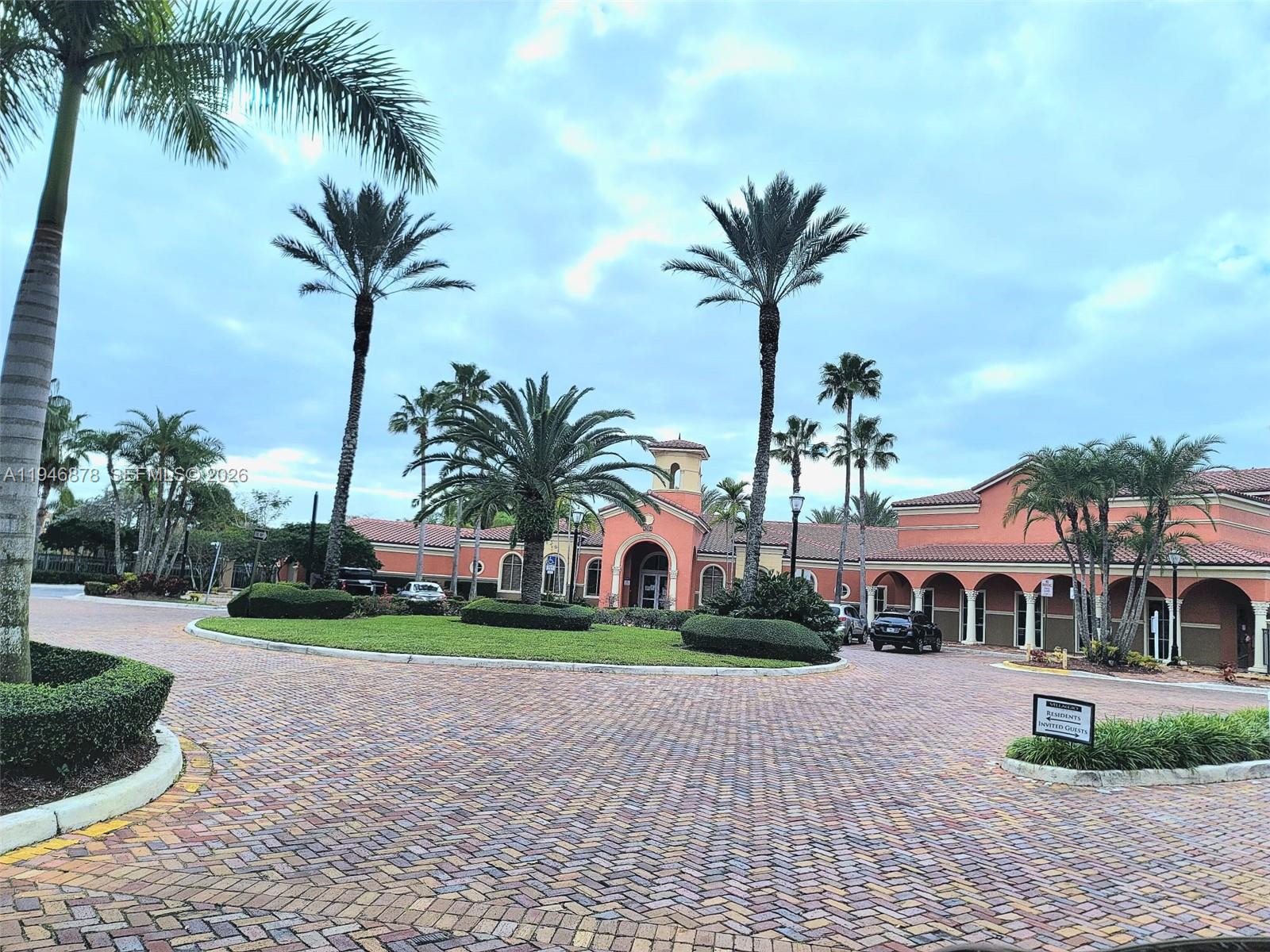 4602 Southwest 160th Avenue, Unit 536 Miramar, FL 33027 - Photo 26 of 30 a view of a house with a yard and palm trees