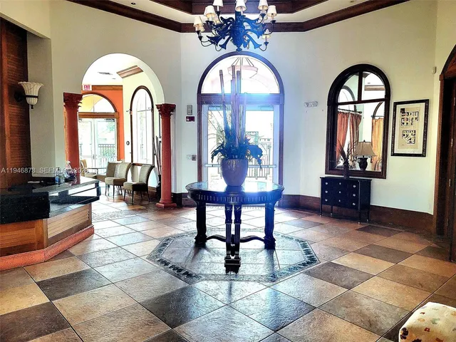 a view of a swimming pool with a dining table and chairs