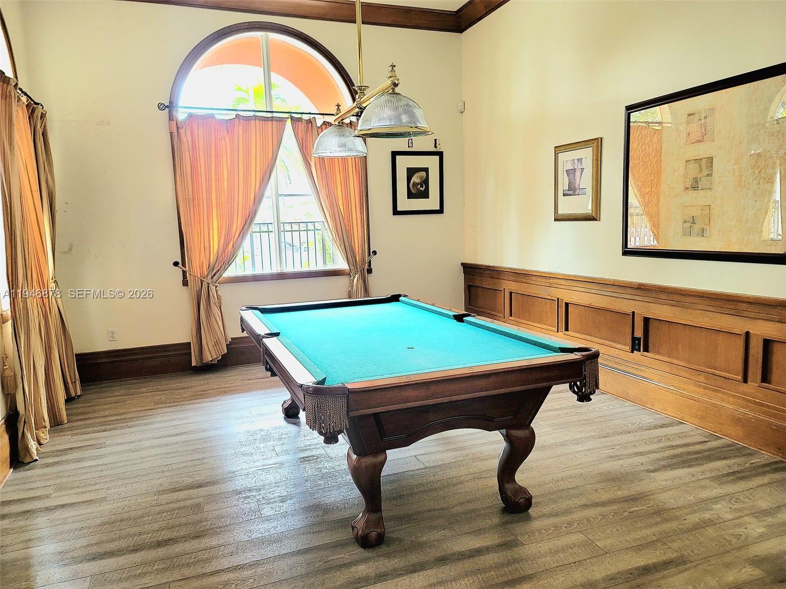 4602 Southwest 160th Avenue, Unit 536 Miramar, FL 33027 - Photo 28 of 30 a room with pool table and windows