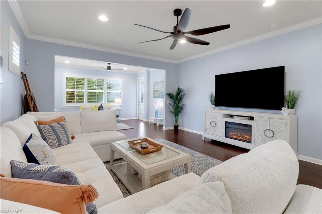 10588 Jackson Square Drive Estero, FL 33928 - Photo 13 of 50 a living room with furniture and a flat screen tv