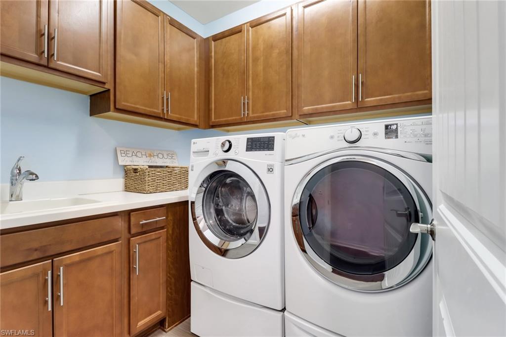 10588 Jackson Square Drive Estero, FL 33928 - Photo 28 of 50 a utility room with sink dryer and washer