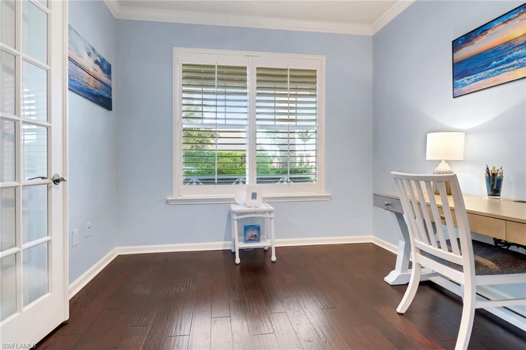 10588 Jackson Square Drive Estero, FL 33928 - Photo 4 of 50 a view of a room with wooden floor and windows