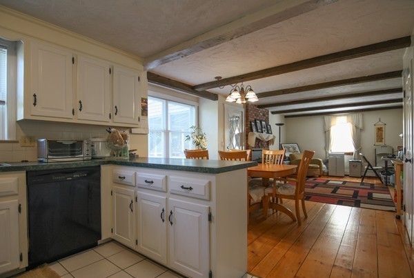 400 Stow Road Boxborough, MA 01719 - Photo 12 of 22 a kitchen with cabinets and chairs in it