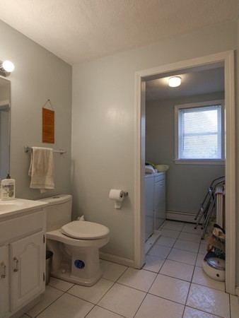 400 Stow Road Boxborough, MA 01719 - Photo 14 of 22 a bathroom with a toilet sink and mirror