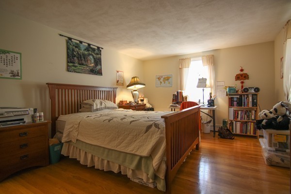 400 Stow Road Boxborough, MA 01719 - Photo 17 of 22 a bed room with a bed and a night stand