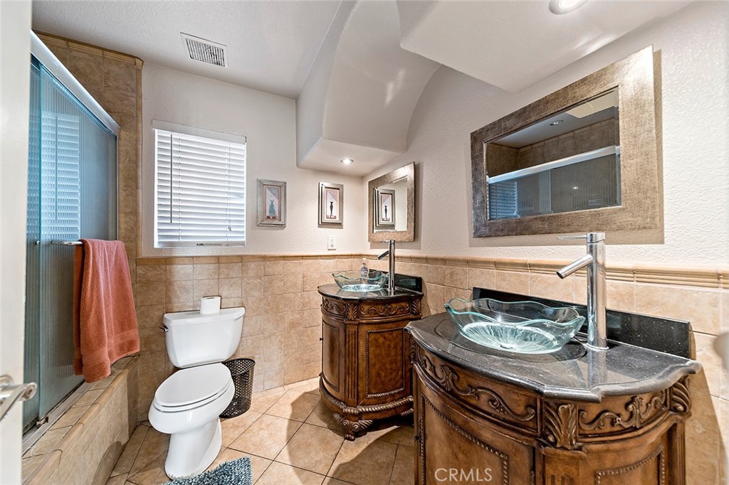 1704 Pass And Covina Road West Covina, CA 91792 - Photo 14 of 29 a bathroom with a sink a toilet and mirror