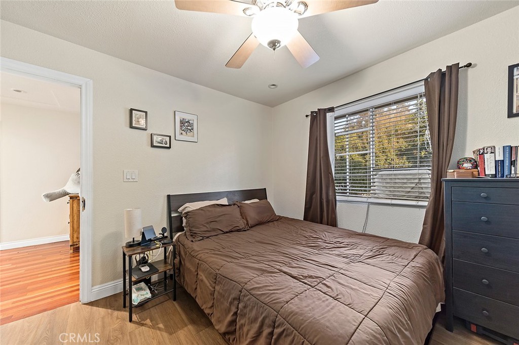1704 Pass And Covina Road West Covina, CA 91792 - Photo 17 of 29 a bedroom with a bed and a chandelier