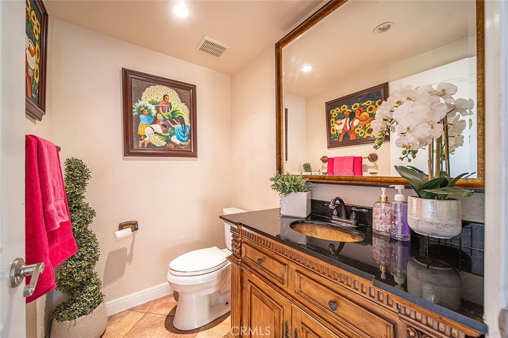 1704 Pass And Covina Road West Covina, CA 91792 - Photo 20 of 29 a bathroom with a toilet sink and vanity