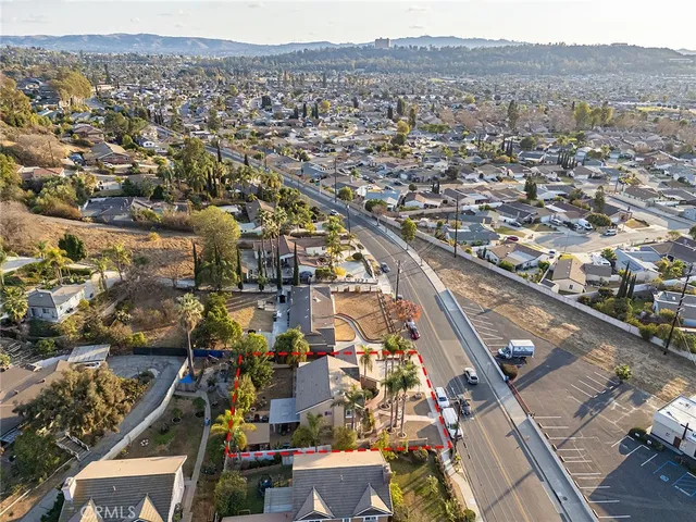 an aerial view of residential houses with outdoor space