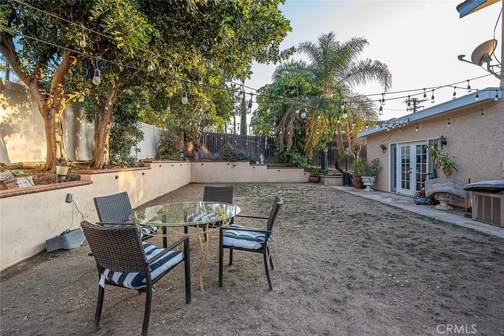 1704 Pass And Covina Road West Covina, CA 91792 - Photo 26 of 29 a view of a patio with table and chairs and potted plants