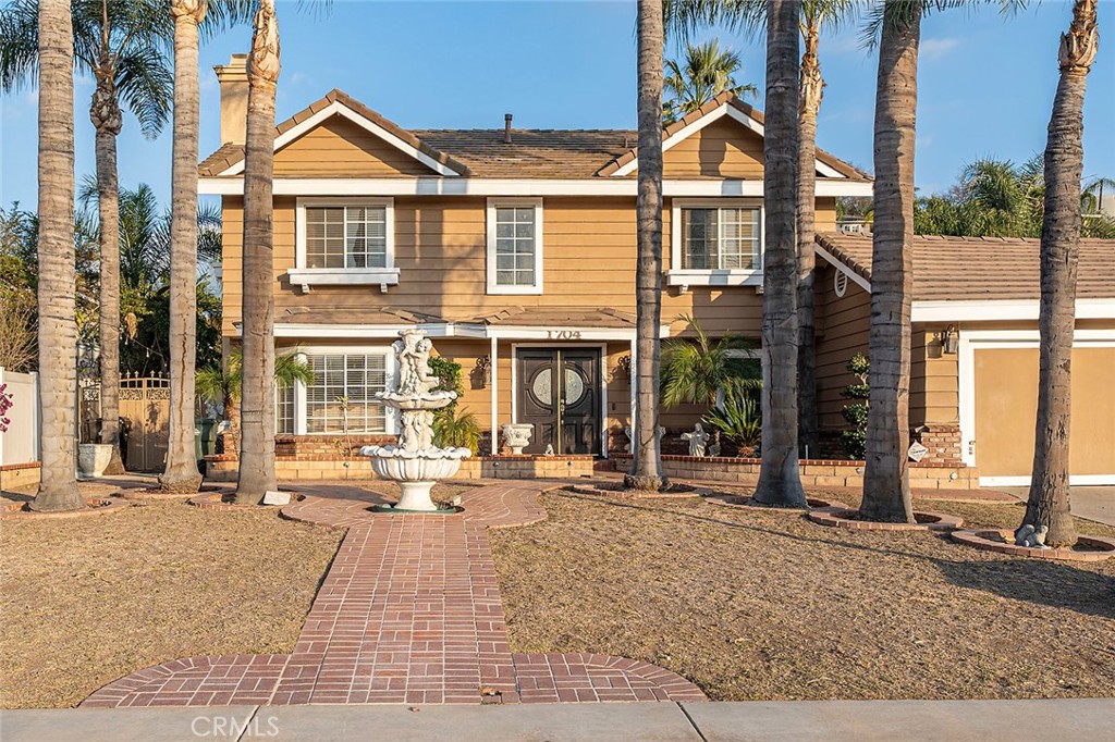 1704 Pass And Covina Road West Covina, CA 91792 - Photo 29 of 29 front view of a brick house with a outdoor space