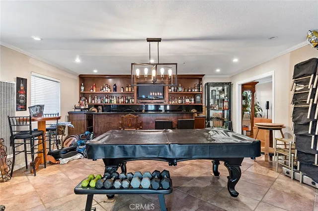 a kitchen with stainless steel appliances granite countertop a lot of cabinets