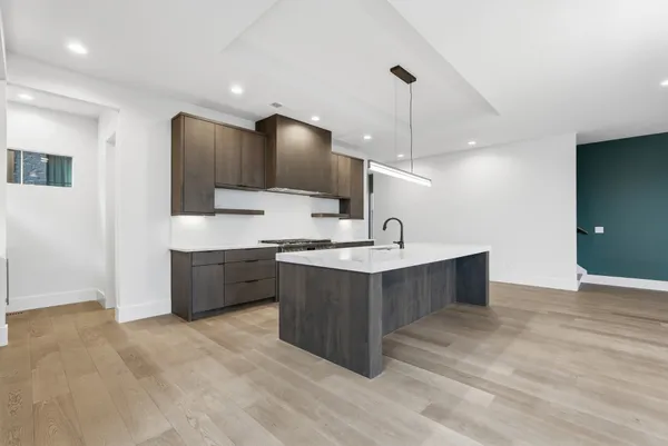 a kitchen with a sink and cabinets