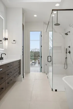 a spacious bathroom with a double vanity sink and shower