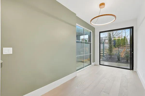 a view of empty room with windows