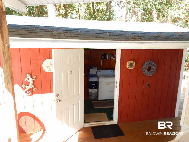 417 Maria Drive Lillian, AL 36549 - Photo 22 of 32 Shed out the back door of the sunroom