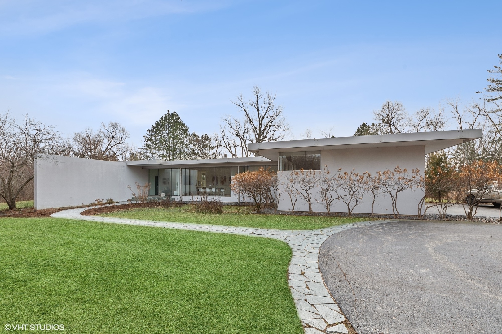 2747 Ridge Road Highland Park, IL 60035 - Photo 1 of 31 a view of a house with a yard and a garden